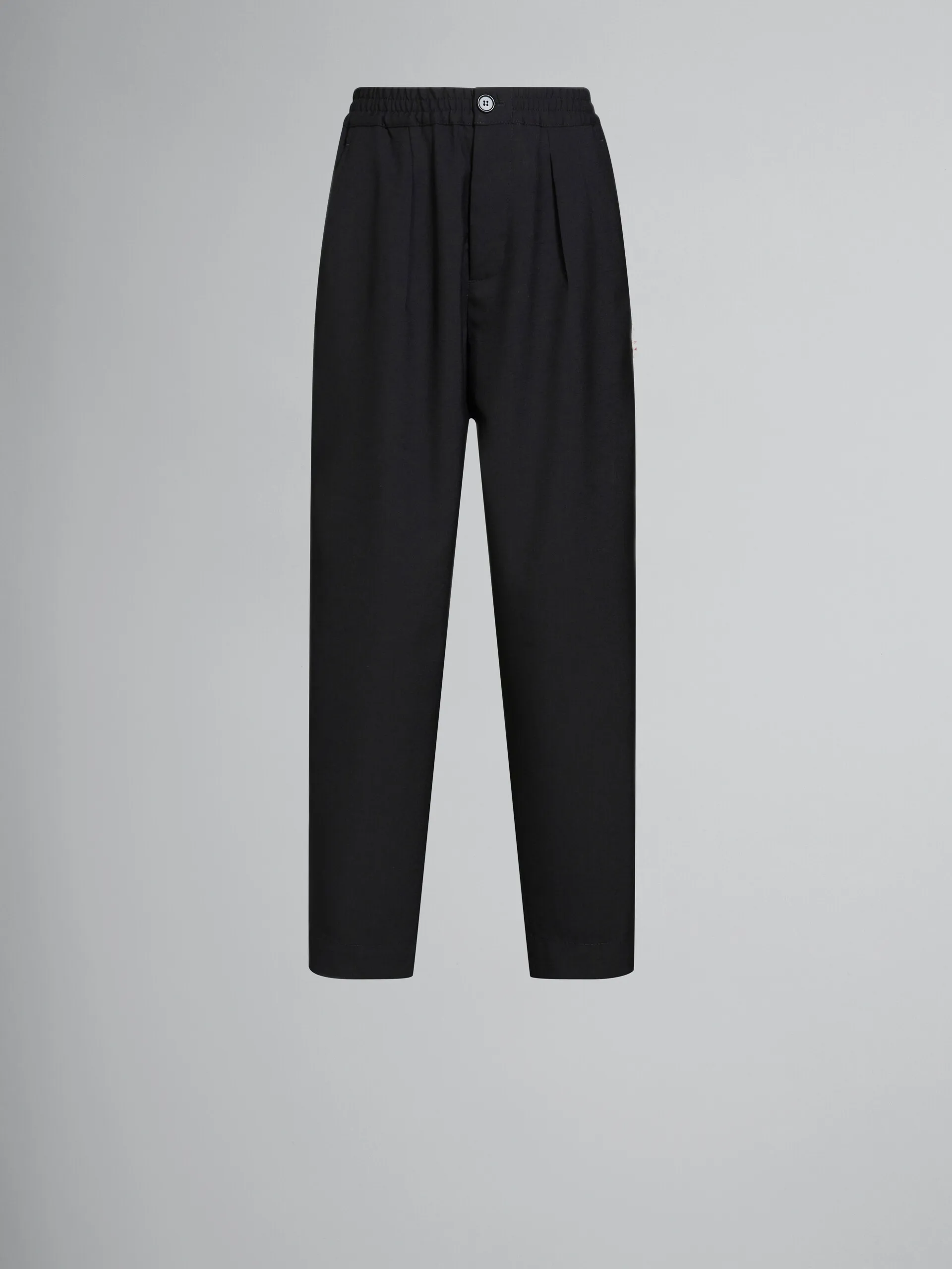 Pantaloni in lana nera con pieghe sul davanti