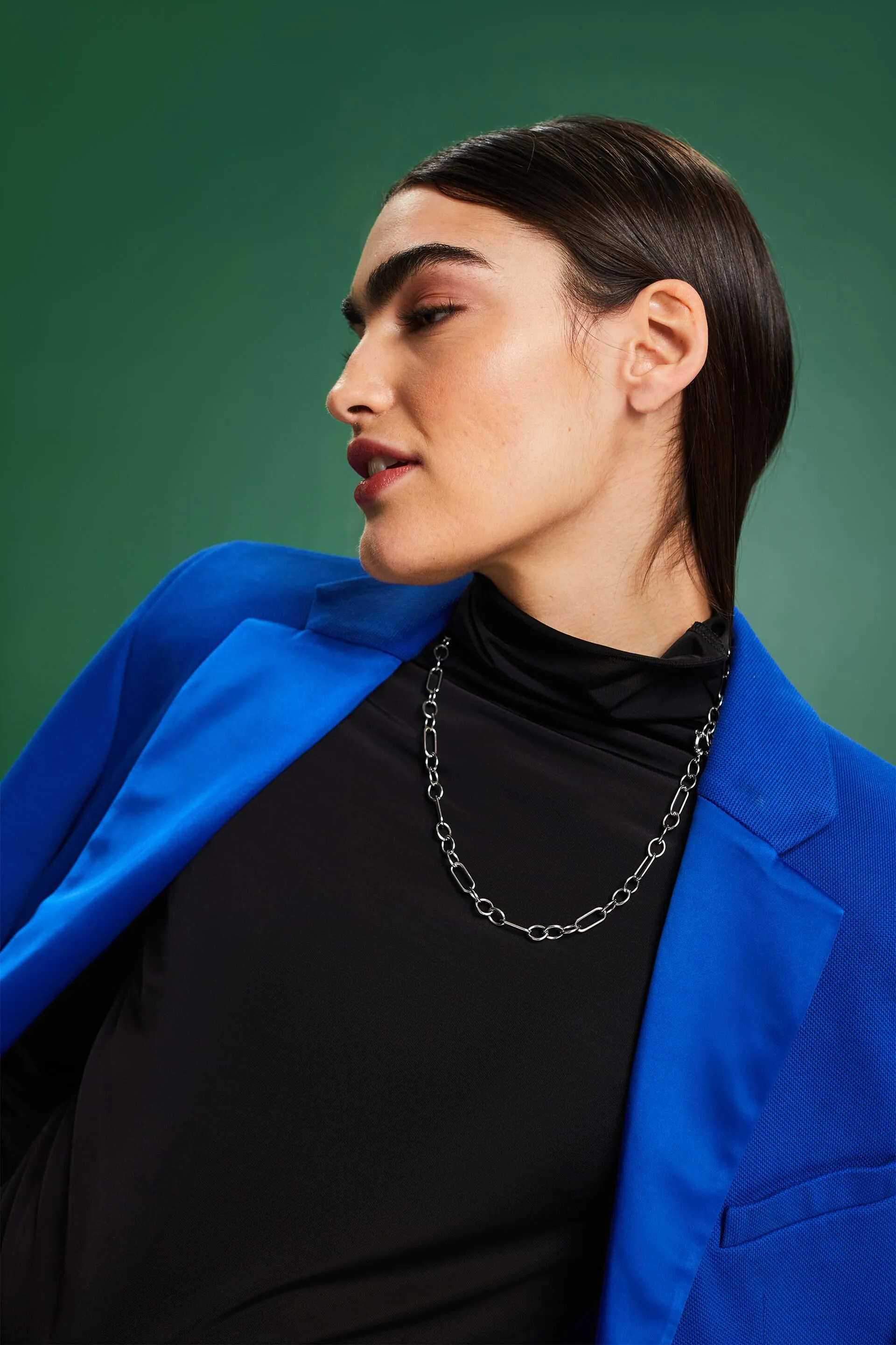 Top a maniche lunghe con collo a lupetto